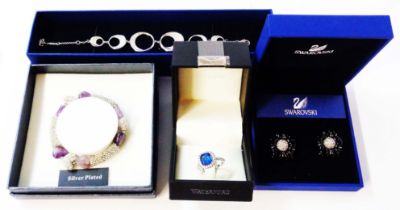 A Swarovski fancy open crescent-link bracelet and a pair of earrings - sold with a Waterford crystal