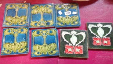 Five Art Nouveau pottery tiles with embossed decoration - sold with two similar