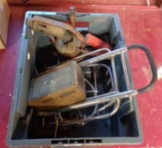 A crate containing a suitcase trolley, a blowtorch and a quantity of drill bits