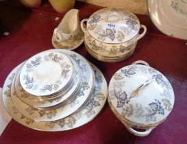 A quantity of Coalport bone china dinner ware decorated in the Camelot pattern including tureens,