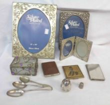 A box containing three assorted silver plated photograph frames, two compact cases, etc. - sold with