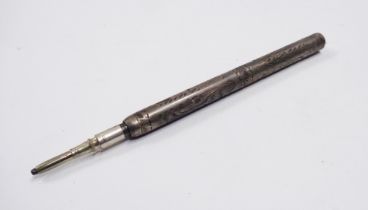 An old white metal mechanical pencil with engraved decoration