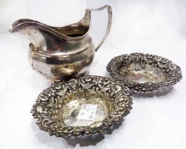 A pair of silver bon bon dishes with embossed mask and swag decoration - sold with a silver cream