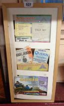 A framed collection of festival and gig tickets including Glastonbury, Michael Jackson, Oasis, etc.