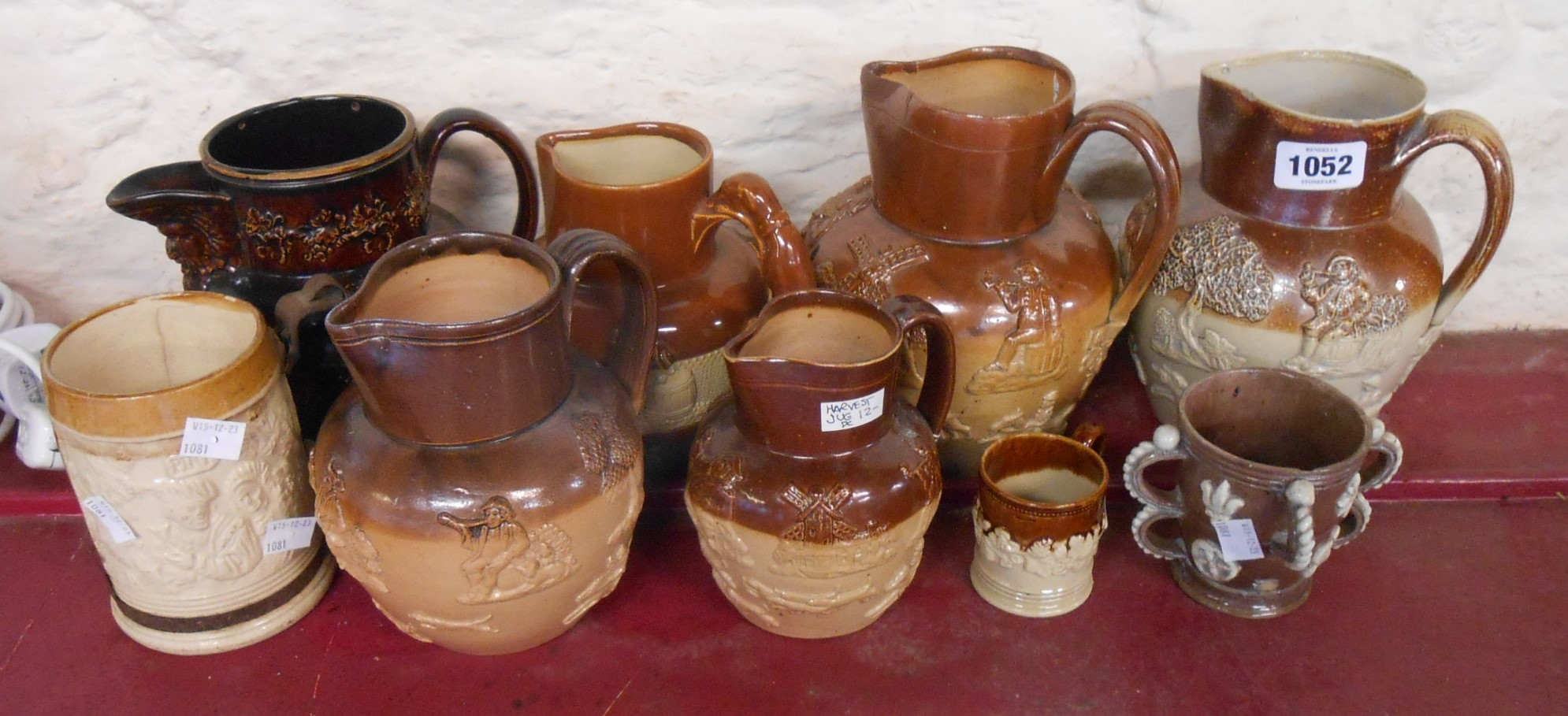 A quantity of 19th Century salt glazed and other stoneware harvest jugs, mugs, etc. - various