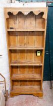 A 68cm pine five shelf open bookcase, set on a bracket base - 1.8m high