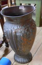 A large Italian copper vase with embossed decoration