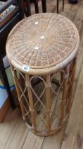 A 46cm modern wicker and cane bound tea table