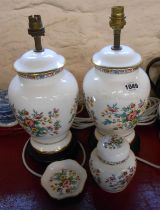 A pair of Coalport bone china table lamps decorated in the Ming Rose pattern, set on hardwood stands