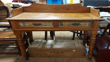 An 89cm pine washstand in the Victorian style with two frieze drawers, set on turned legs with