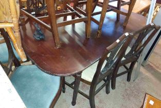 A 1.7m reproduction mahogany and strung dining table, set on reeded legs
