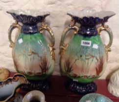 A pair of large Edwardian ceramic vases with gilt tube-lined lovebird decoration