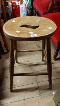 A vintage bar stool with moulded solid elm seat, set on tapered supports