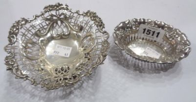 A silver bon bon dish with pierced and embossed decoration, set on ornate cast base - London