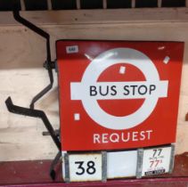 A double sided enamel London Transport request bus stop sign, with original brackets - showing route