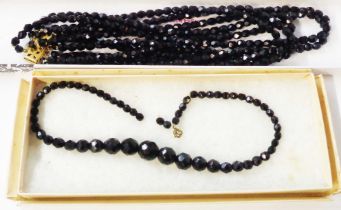 A vintage five string jet bead necklace - sold with an older single string graduated bead