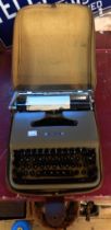 A vintage Olivetti Lettera 22 portable typewriter in original carry case