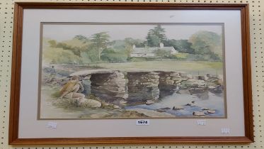 A framed watercolour, depicting a local scene with clapper bridge