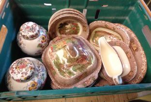 A crate containing a quantity of assorted ceramics comprising a pair of Mason's ginger jars and lids