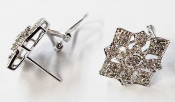 A pair of 375 (9ct.) white gold ornate pierced panel diamond encrusted earrings - boxed