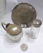 An Indian white metal coaster tray - sold with a silver topped cut glass sugar caster and a large