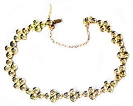 A 750 (18ct.) gold fancy-link multi-diamond bracelet with safety chain