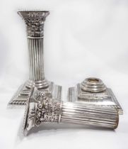 A pair of 13.5cm high silver Corinthian column candlesticks - one a/f - Birmingham 1904/05