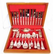 A polished wood cased canteen containing a six place setting of silver plated kings pattern