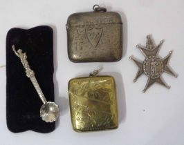 A silver vesta case and a brass similar - sold with a fob and ornate salt spoon