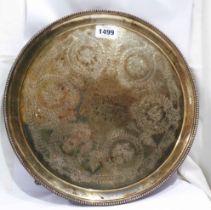 A 33cm diameter Victorian silver tea tray by Walter & John Barnard with profuse engraved