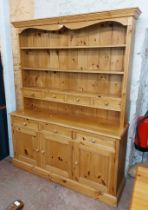 A 1.51m modern pine two part dresser with three shelf open plate rack and four spice drawers over