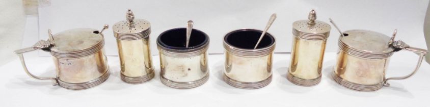 A silver six piece condiment set comprising two each pepperettes, salts and flip-top mustard pots