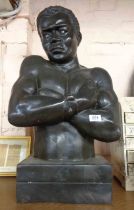 A large hollow cast bronze bust, depicting a manacled African man with inset glass eyes