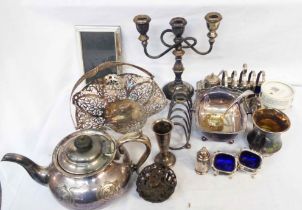 A box containing a quantity of silver plated items including toast racks, pierced cake basket, small