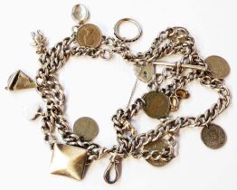 An old silver Albert watch chain (as a charm bracelet), set with mainly cupro-nickel coins, silver