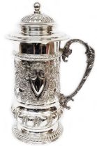 A 32cm high WMF ornate silver plated lidded tankard with embossed decoration and blank cartouche