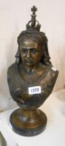 A reproduction antiqued brass bust of Queen Victoria with bronze effect finish, set on pedestal