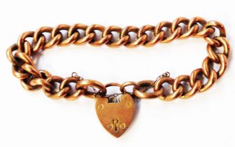 A 9ct. rose gold kerb-link bracelet with hallmarked padlock - links stamped 9c