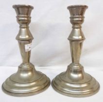 A pair of 18cm high silver plated candlesticks