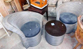 A pair of modern designer chairs with bentwood and cane shaped frames, drum bases and circular