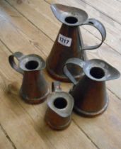 A set of four graduated copper measures