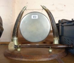An early 20th Century table gong and beater with antler supports and silver plated fittings