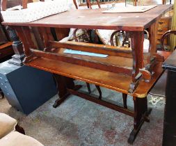 A 1.53m pine refectory style table, set on standard ends with pegged stretcher - sold with two