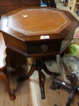 A 46cm reproduction drum worktable with leather inset top, set on turned pillar with quadruple