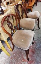 A set of four Victorian mahogany framed balloon back dining chairs with velour upholstered seats,