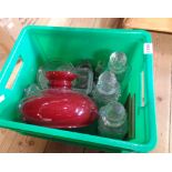 A crate containing a quantity of assorted glassware including decanters, lamp shade, etc.