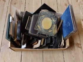 A box of small old frames including wooden, metal and other examples