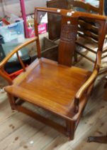 A late Chinese polished hardwood framed elbow chair with carved splat and panelled solid seat, set
