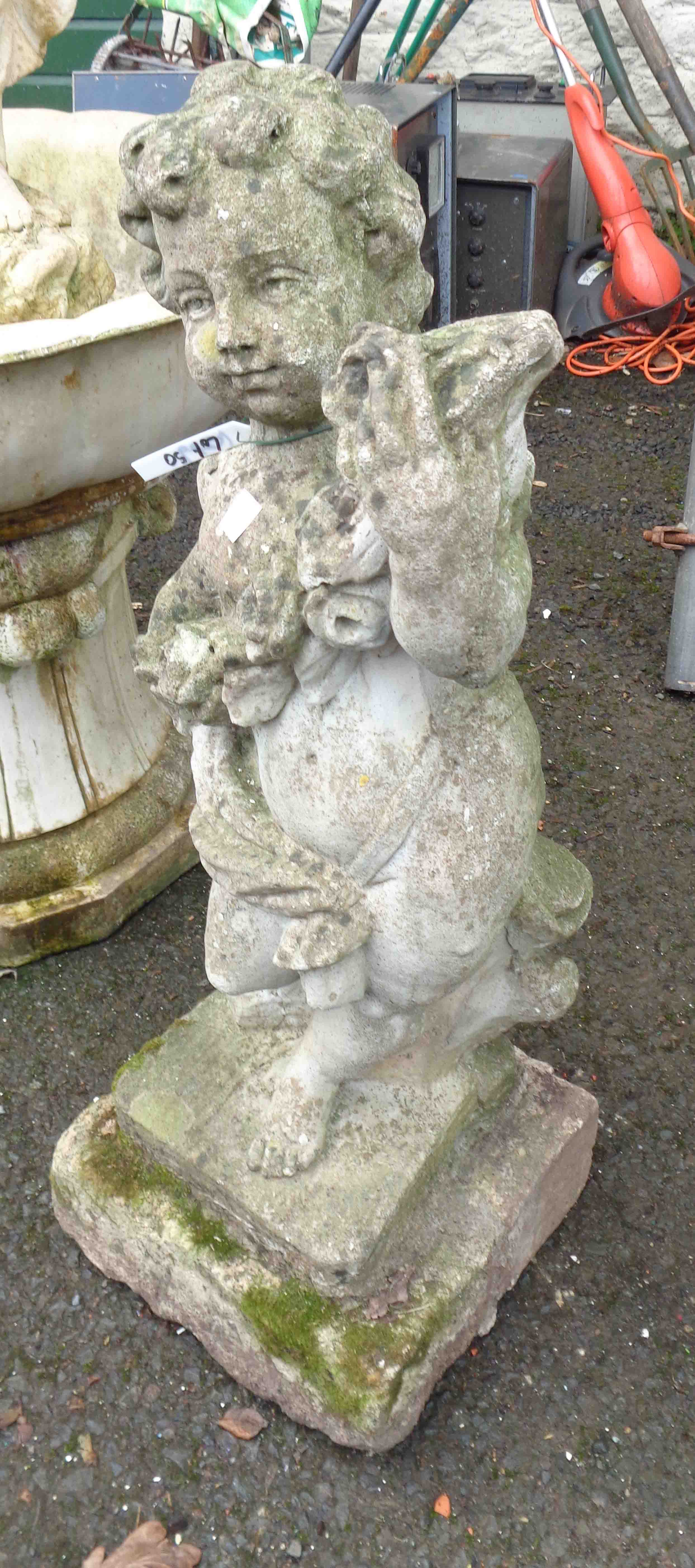 An 80cm high concrete statue depicting a cherub, set on plinth base