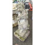 An 80cm high concrete statue depicting a cherub, set on plinth base